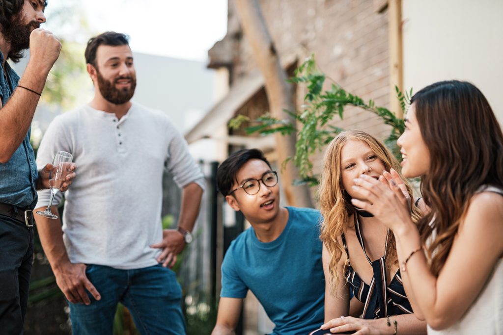 A group of friends practices English fluency at a gathering at their home
