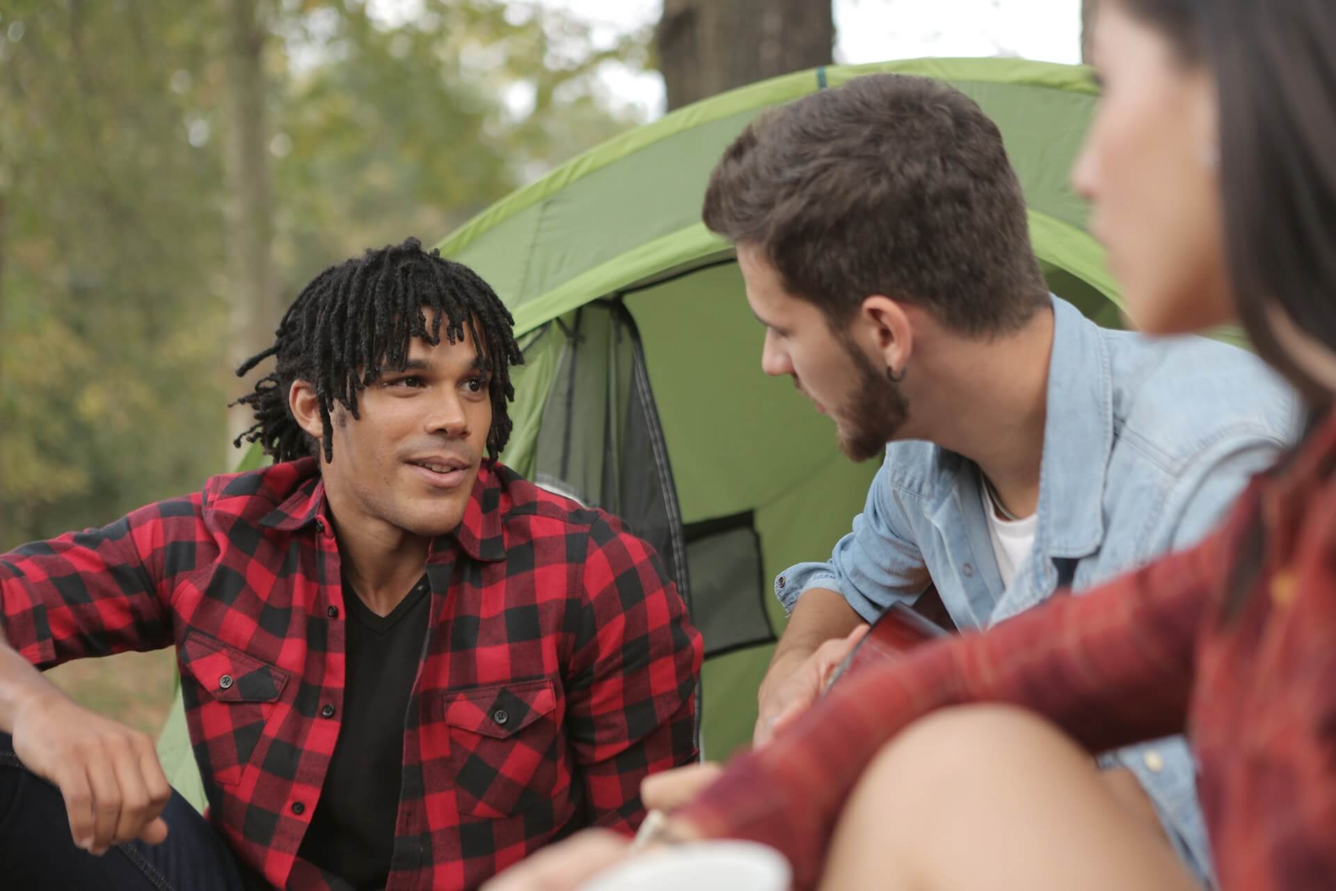 people speaking while camping