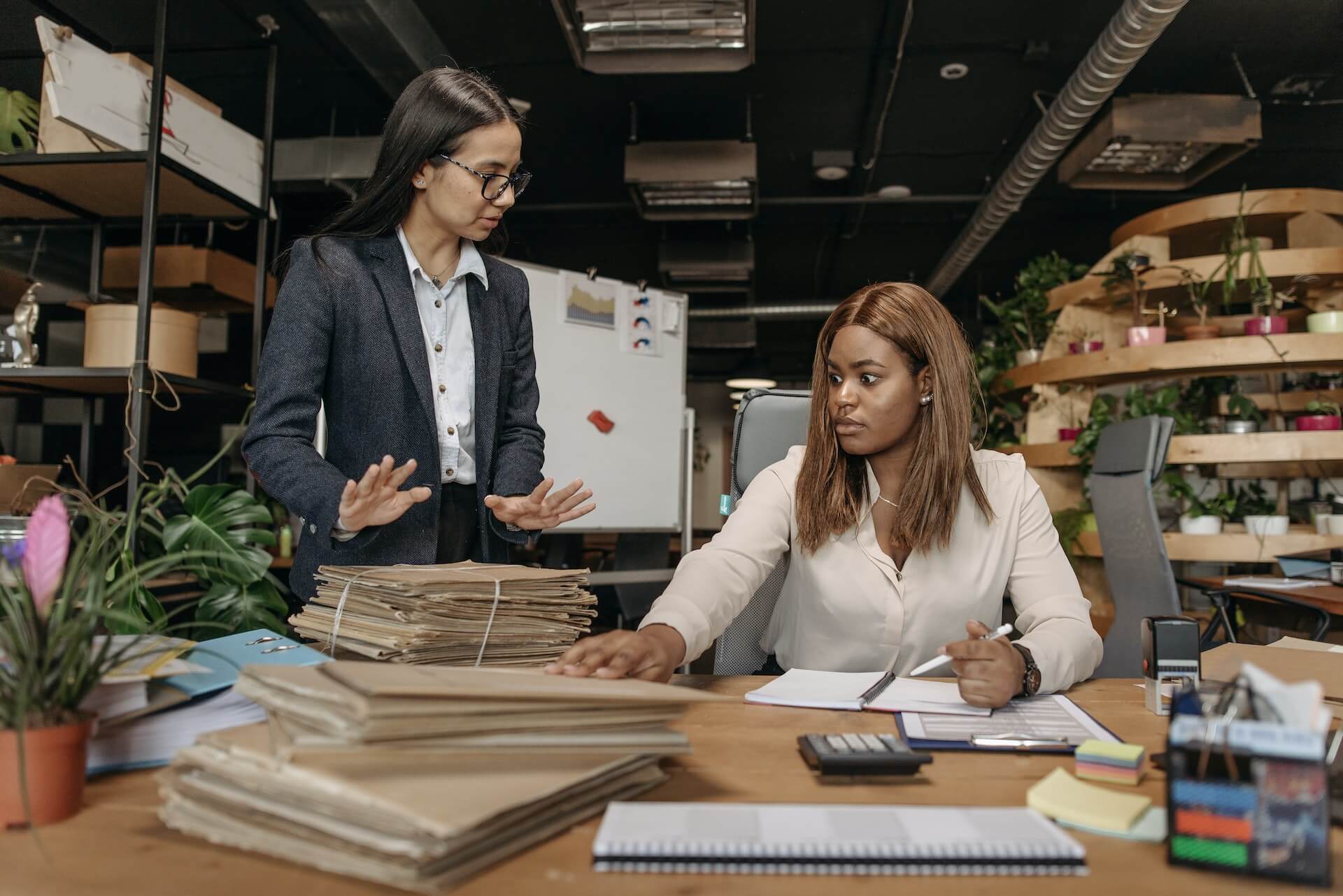 Office employees discussing work