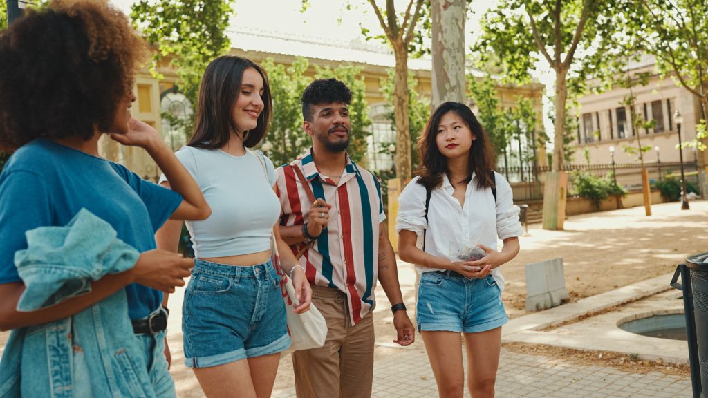 A group of friends takes a walk to practice their English fluency skills